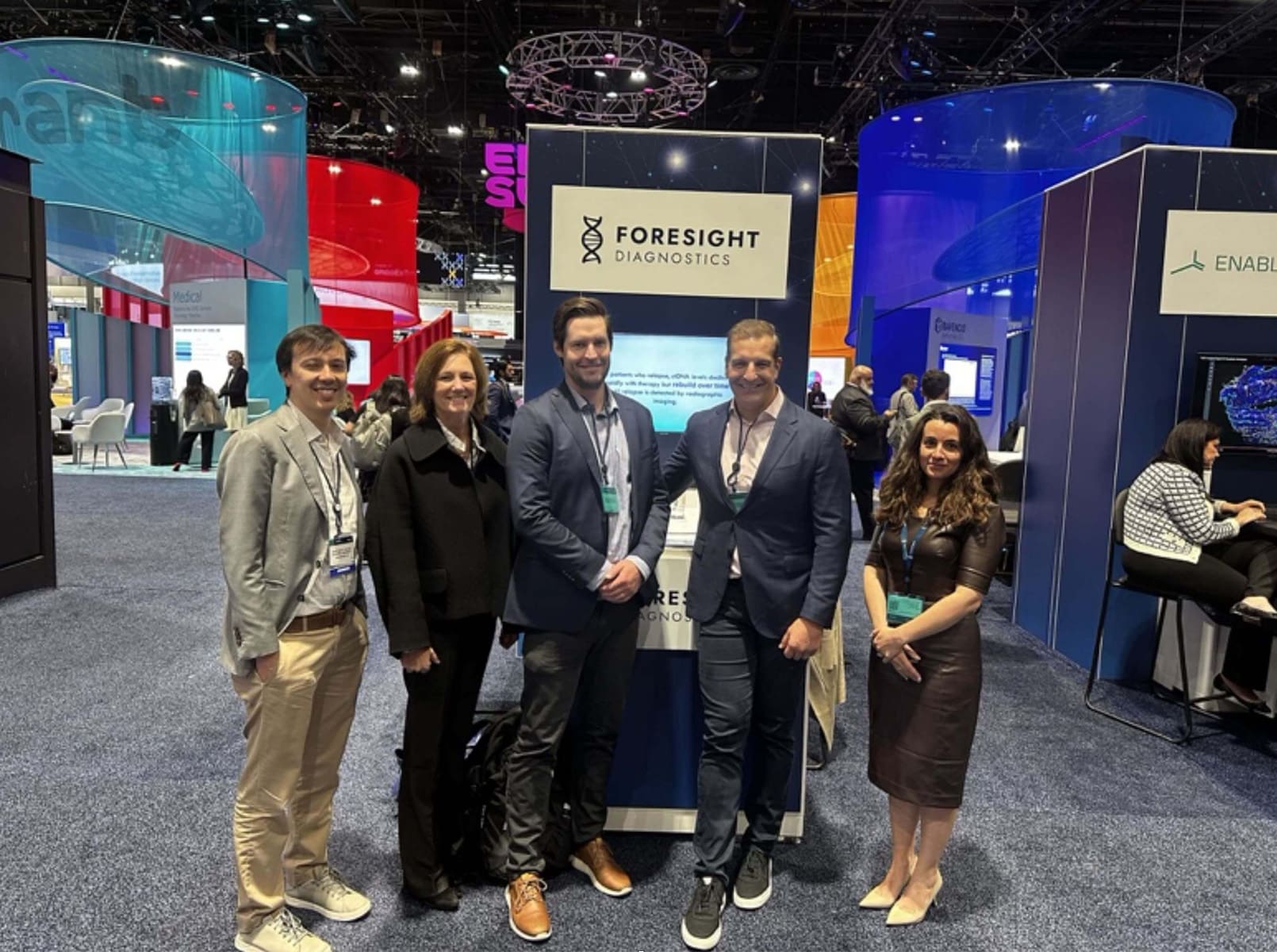 Foresight employees at ASCO booth